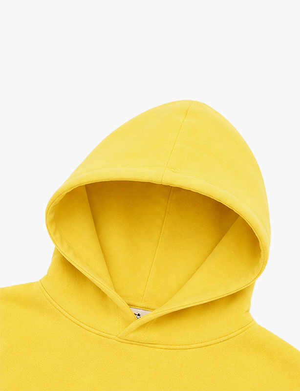 Heavyweight cotton-blend oversized pullover hoodie with a kangaroo pocket and adjustable drawstring hood in neutral earth tones.
