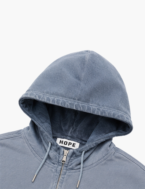Premium relaxed-fit graphic hoodie featuring a front pouch pocket, ribbed cuffs, and a soft fleece-lined hood for urban style.